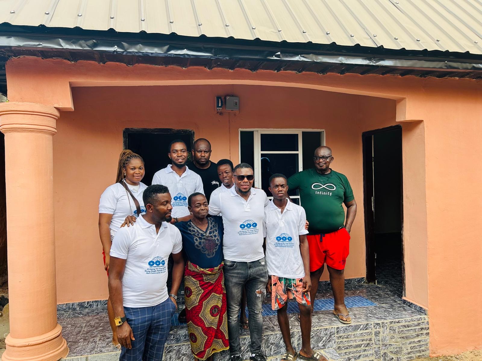 GAP International team and community members outside a supported home