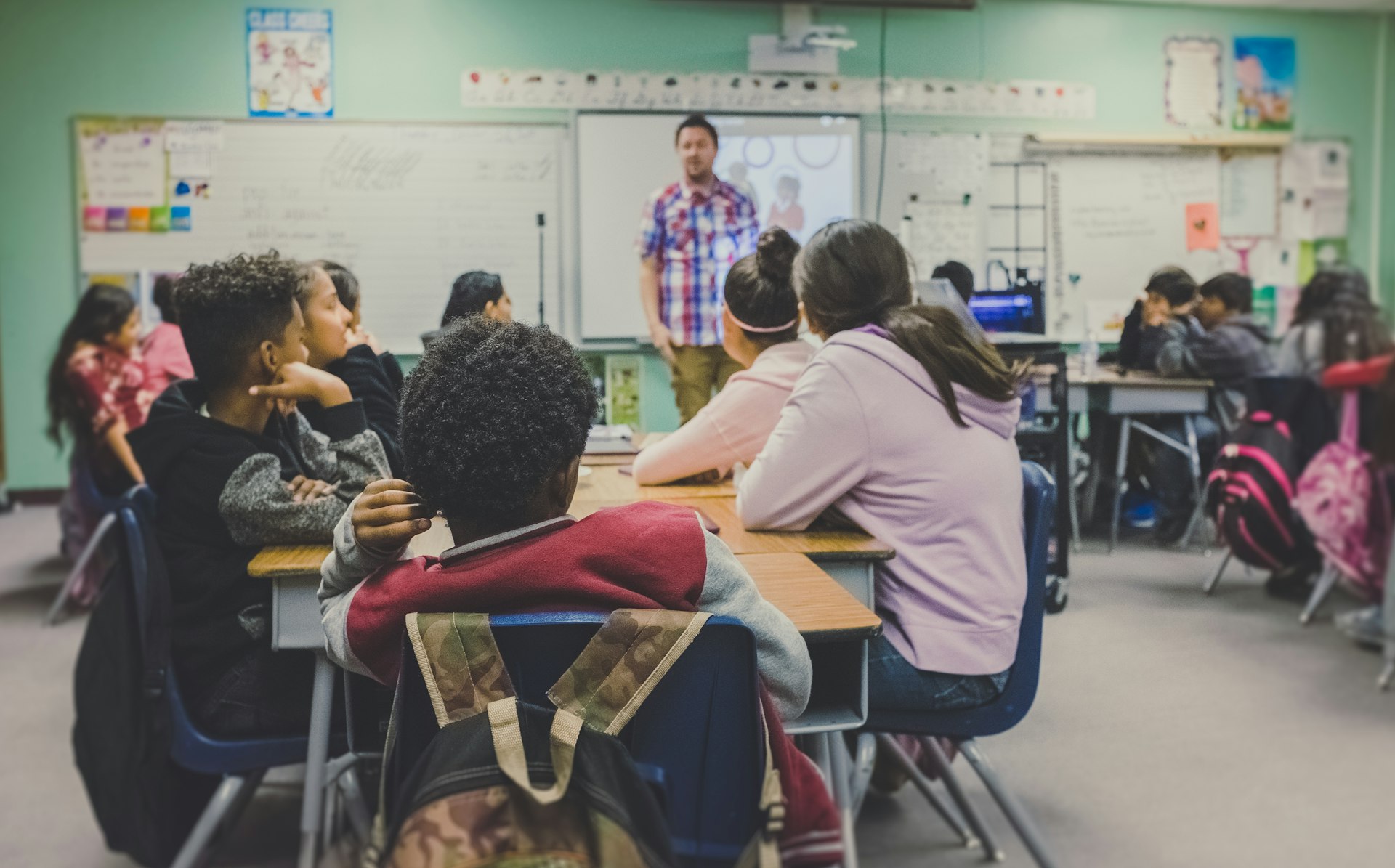 Students in a classroom — education is at the heart of our mission